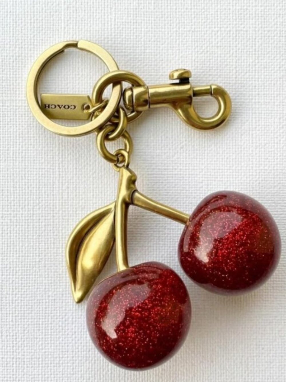 New Coach Signature Cherry Bag Charm – Luxury Keychain & Purse Accessory